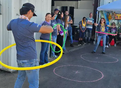 Garaga employees from Ponca City facility in Oklahoma are hula hooping in an outdoor setting