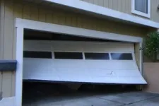 Garage door off its tracks
