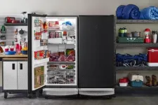 Big freezer with an open door in a garage