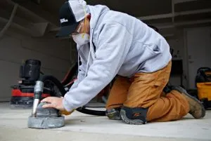 someone sandblasting floor
