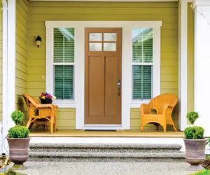view of an entry door with chairs