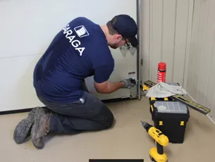 someone reparing a garage door