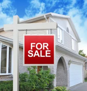 House with a garage door for sale