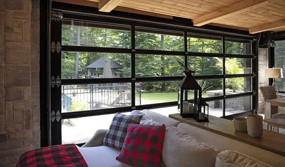 A picture from inside the living room of a Scandinavian house of a full-view California garage door