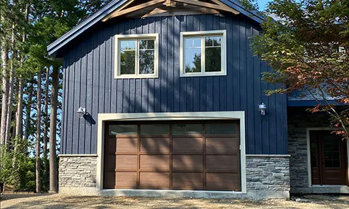 Cambridge CL garage door, 16' x 8', Chocolate Walnut Faux Wood door and overlays, Panoramic windows with Clear glass