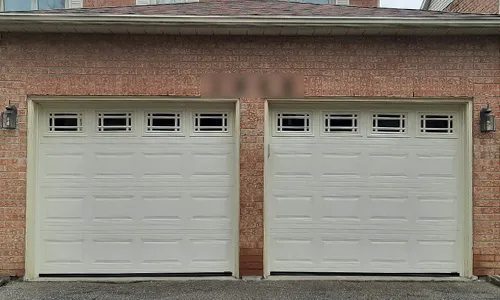 Brick house with Classic CC garage doors, 8' x 7', windows with Prairie Inserts