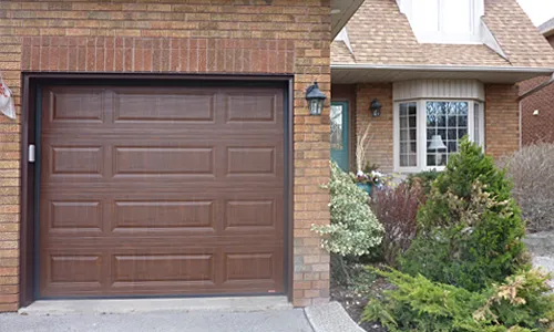 Brick brown house with Classic MIX garage door, 8' x 7', American Walnut Faux Wood